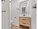 Well-lit bathroom features a modern vanity, stylish mirror, sleek fixtures, and a walk-in shower at 421 Villa Woods Dr., Myrtle Beach, SC 29579