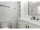 Bright bathroom features a modern vanity with sleek fixtures, built-in shelving, and a toilet at 421 Villa Woods Dr., Myrtle Beach, SC 29579