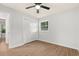This bright bedroom features a ceiling fan, wood-look flooring, and a closet with white doors at 421 Villa Woods Dr., Myrtle Beach, SC 29579
