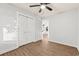 Bedroom features wood-look flooring, a ceiling fan, and a closet with white doors at 421 Villa Woods Dr., Myrtle Beach, SC 29579