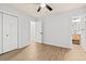 Bright bedroom with wood-look floors and a view into the bathroom at 421 Villa Woods Dr., Myrtle Beach, SC 29579