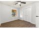 This bright bedroom features a ceiling fan, attractive floors, and a closet with white doors at 421 Villa Woods Dr., Myrtle Beach, SC 29579