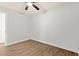Bedroom features wood-look flooring, a ceiling fan, and a nearby doorway to another room at 421 Villa Woods Dr., Myrtle Beach, SC 29579