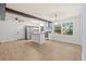 Bright kitchen boasts stainless steel appliances, patterned backsplash, and a center island at 421 Villa Woods Dr., Myrtle Beach, SC 29579