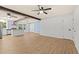 Open-concept living space with a view of kitchen and dining area, showcasing wood flooring at 421 Villa Woods Dr., Myrtle Beach, SC 29579