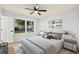 Cozy bedroom with a bed, accent lamps, and wood-look flooring at 421 Villa Woods Dr., Myrtle Beach, SC 29579