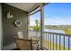 Enjoy the serene water view from this cozy balcony with seating at 4503 W Harbour Ct. # S9, Little River, SC 29566