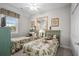 Charming bedroom with two beds, green bed frames, and decor creating a warm, inviting atmosphere at 4503 W Harbour Ct. # S9, Little River, SC 29566