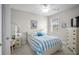 Cozy bedroom featuring a comfy bed with blue and white striped bedding and coastal-themed decorations at 4503 W Harbour Ct. # S9, Little River, SC 29566