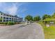 Community entrance featuring a gated access and lush landscaping on a sunny day at 4503 W Harbour Ct. # S9, Little River, SC 29566