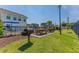 Community grill area featuring picnic tables, grills, and manicured lawn area at 4503 W Harbour Ct. # S9, Little River, SC 29566