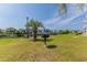 Waterfront community features a grill area with mature palm trees and well-maintained lawns at 4503 W Harbour Ct. # S9, Little River, SC 29566