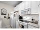 Bright kitchen with white cabinetry and modern appliances at 4503 W Harbour Ct. # S9, Little River, SC 29566