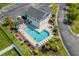 Aerial view of community pool featuring a spacious pool deck, lounge chairs, and lush landscaping at 4503 W Harbour Ct. # S9, Little River, SC 29566