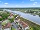 Aerial view of property on the water with parking and nearby amenities at 4616 Greenbriar Dr. # H-4, Little River, SC 29566