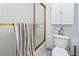 Cozy bathroom featuring a toilet, enclosed shower, storage cabinet, and neutral colors at 4616 Greenbriar Dr. # H-4, Little River, SC 29566