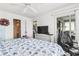 Comfortable bedroom featuring a bed with sea-themed sheets, sliding glass doors, and a dresser at 4616 Greenbriar Dr. # H-4, Little River, SC 29566