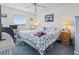 Inviting bedroom featuring a bed with a sea-themed quilt, a ceiling fan, and a desk at 4616 Greenbriar Dr. # H-4, Little River, SC 29566