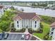 Beautiful three-story condo building near water, with well-maintained landscaping and ample parking at 4616 Greenbriar Dr. # H-4, Little River, SC 29566