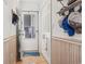 Hallway featuring beadboard paneling, a wood floor, and nautical themed decor including a whale rug at 4616 Greenbriar Dr. # H-4, Little River, SC 29566