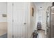 Hallway adjacent to a kitchen with beadboard paneling, a pantry door, and view of a refrigerator at 4616 Greenbriar Dr. # H-4, Little River, SC 29566