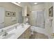 Bright bathroom with double sinks, a large mirror, and a shower at 4878 Luster Leaf Circle # 402, Myrtle Beach, SC 29577