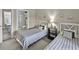Bedroom featuring 2 beds, a small bathroom, and coastal decor at 4878 Luster Leaf Circle # 402, Myrtle Beach, SC 29577