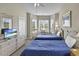 Bright bedroom with twin beds, a ceiling fan and large windows with views at 4878 Luster Leaf Circle # 402, Myrtle Beach, SC 29577