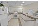 A view of a full kitchen and lots of countertops and storage spaces and a tile floor at 4878 Luster Leaf Circle # 402, Myrtle Beach, SC 29577