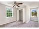 Bedroom featuring carpet floors, a ceiling fan, and windows for natural light at 505 Forestbrook Dr., Myrtle Beach, SC 29579