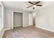 Bedroom featuring a ceiling fan, wood-look floors, and a closet with bi-fold doors at 505 Forestbrook Dr., Myrtle Beach, SC 29579