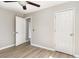 Bedroom featuring a ceiling fan, wood-look floors, and access to another room at 505 Forestbrook Dr., Myrtle Beach, SC 29579