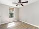 Bedroom featuring wood-look floors, a ceiling fan, and natural light from a window at 505 Forestbrook Dr., Myrtle Beach, SC 29579