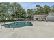 Well-maintained community pool with lounge chairs, tables, and a nearby recreational building at 505 Forestbrook Dr., Myrtle Beach, SC 29579