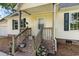 Inviting front porch with flower pots and brick steps at 505 Forestbrook Dr., Myrtle Beach, SC 29579