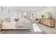 Spacious bedroom filled with natural light, neutral decor, and comfortable furnishings at 512 Haven View Way, Murrells Inlet, SC 29576