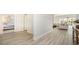 Hallway showcasing light wood flooring, leading to the bedroom and living room area at 512 Haven View Way, Murrells Inlet, SC 29576