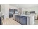 Spacious kitchen features a large center island with quartz countertops and stainless steel appliances at 512 Haven View Way, Murrells Inlet, SC 29576