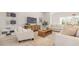 Well-lit living room featuring neutral-toned furniture, a stylish rug, and a media console at 512 Haven View Way, Murrells Inlet, SC 29576