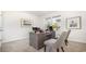 Inviting home office with traditional desk, comfortable seating, artwork, and natural light at 512 Haven View Way, Murrells Inlet, SC 29576