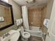 Cozy bathroom features a vanity sink, toilet, and a shower-tub combination with tiled walls, providing essential comfort at 5300 N Ocean Blvd. # 310, Myrtle Beach, SC 29577