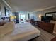 Bright bedroom boasts ocean view, king bed, sofa, and dining area, creating a relaxing and functional living space at 5300 N Ocean Blvd. # 310, Myrtle Beach, SC 29577