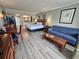 Comfortable bedroom area featuring a queen bed, sofa, dining table, and stylish decor, offering a relaxing retreat at 5300 N Ocean Blvd. # 310, Myrtle Beach, SC 29577