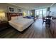 Bright bedroom boasts ocean view, king bed, sofa, and dining area, creating a relaxing and functional living space at 5300 N Ocean Blvd. # 310, Myrtle Beach, SC 29577