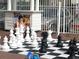 Outdoor chess board with oversized game pieces and a snow cone stand creates a unique beachfront amenity at 5300 N Ocean Blvd. # 310, Myrtle Beach, SC 29577