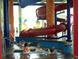 Relaxing indoor pool with a hot tub and colorful waterslide, offering a fun and active recreational space at 5300 N Ocean Blvd. # 310, Myrtle Beach, SC 29577