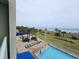 Relax on lounge chairs by the pool overlooking the beach and beautiful ocean at 5300 N Ocean Blvd. # 310, Myrtle Beach, SC 29577