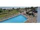 View of an outdoor pool near the beach and wooden walking bridge at 5300 N Ocean Blvd. # 310, Myrtle Beach, SC 29577
