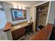 Bathroom vanity features a granite countertop, mirror, and lighting, complemented by a closet with storage solutions at 5300 N Ocean Blvd. # 310, Myrtle Beach, SC 29577