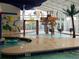 A fun water park area with sprinkler features, a palm tree, and a tropical parrot design at 5300 N Ocean Blvd. # 310, Myrtle Beach, SC 29577